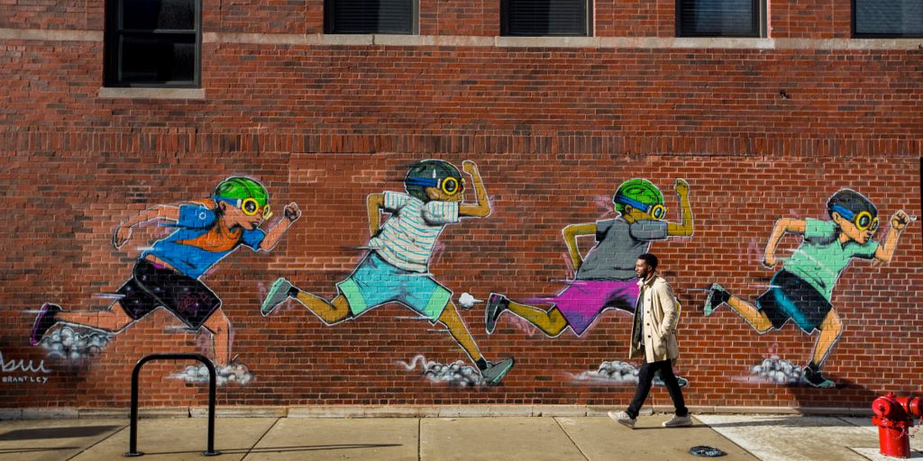 street art of 4 children running